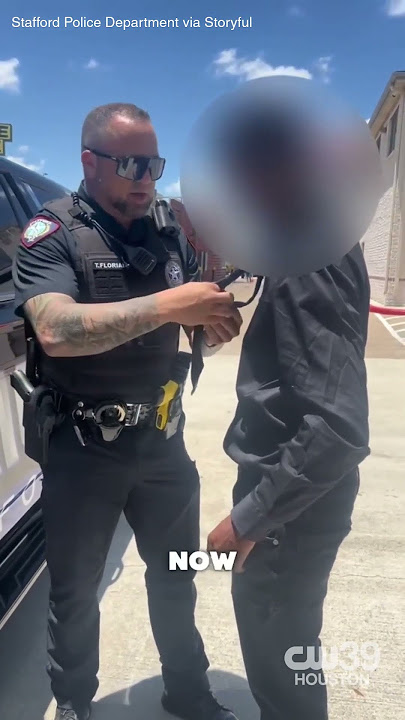 Stafford police officer helps young man with his tie before job interview