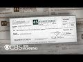 Fake check scams "exploding epidemic," new report says