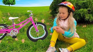 Bogdan teaches his little sister Anabella how to ride a bicycle.