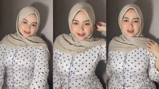 Beautiful, sweet, natural hijab mother wearing nightgown