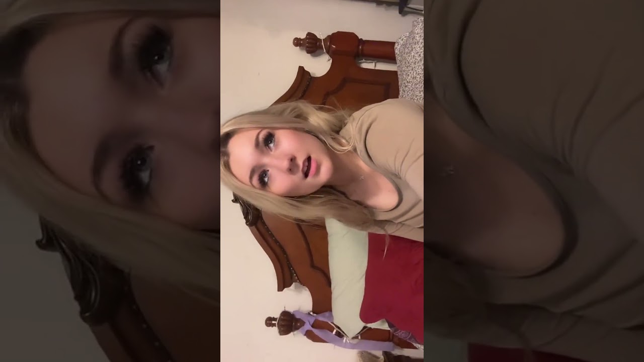 Blonde Woman Lip-Syncing in Bed