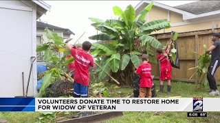 Volunteers donate time to restore home for widow of veteran