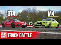 BMW M4 Competition vs Porsche Cayman GT4: Steve Sutcliffe track battle | Auto Express