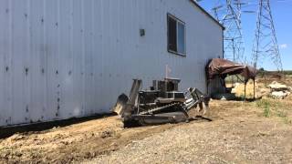 RC D10T Bulldozer pushing dirt and ripping