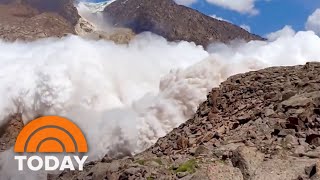 Avalanche Sweeps Over Hiker Climbing In Kyrgyzstan Mountains