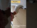 Manual Surface Scraping for Smooth Plaster Finish