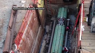 Protesters arrested after locking themselves in drill equipment in West Virginia