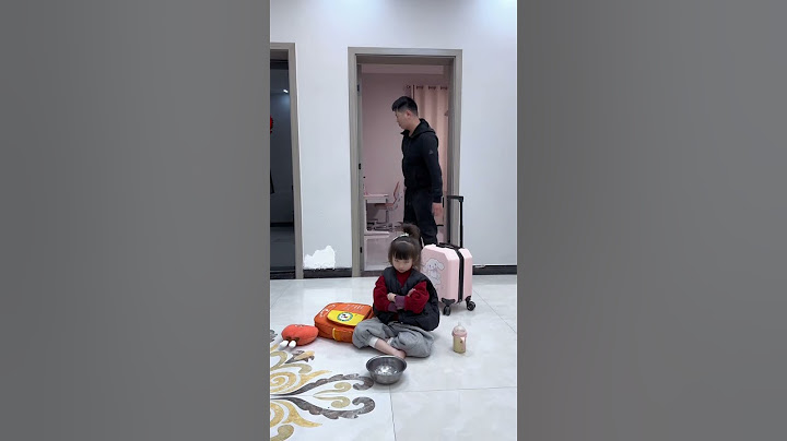 The father was working and the daughter was making trouble beside him. The father threw his daughte