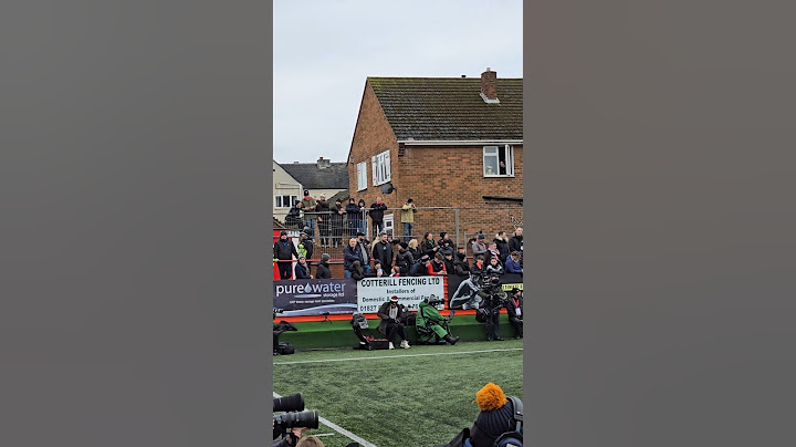 TAMWORTH: Fans Watching the Game Over Fences and Out of Windows: Tamworth v Tottenham