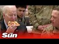 President Biden has pizza with US troops stationed in Poland on the Ukraine border