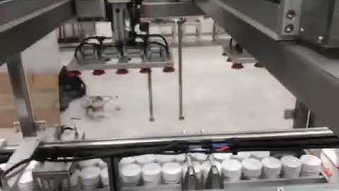 Bottle Top Load Case Packer Robotically loads Cartons into Cases