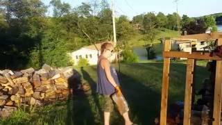 Stacking wood on pallets to move with the tractor - getting ready for winter.