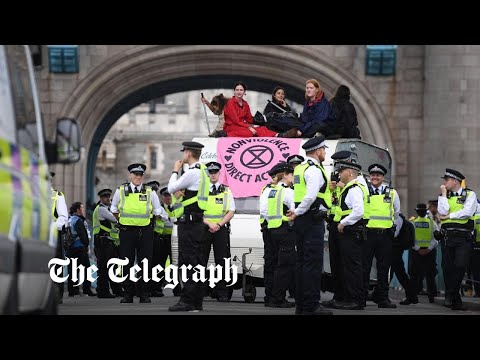 Extinction Rebellion activists block Tower Bridge in London