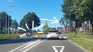 Epic Roundabout Showdown: Cyclist vs. Car – Who Has the Right of Way? #drivingtips #cars
