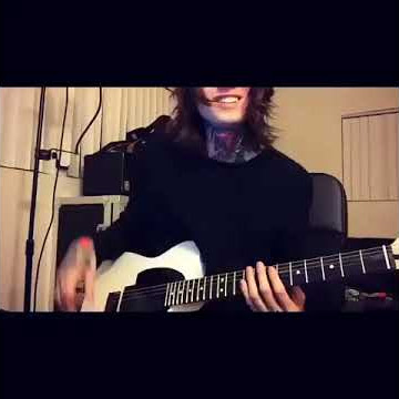 Noah Sebastian playing guitar