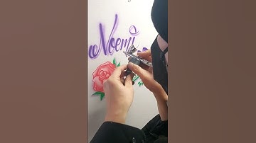 freehand airbrushing a rose and butterfly.