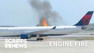 Engine fire aboard Delta Air Lines flight forces evacuations via rescue slides