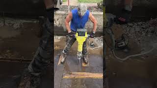 Jackhammering through an old concrete pond structure… because home improvement is never ordinary
