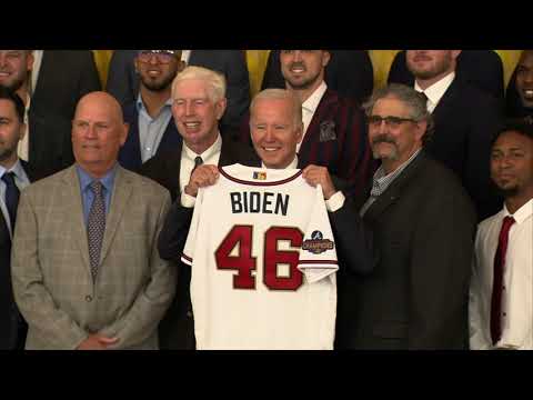 The braves present president biden with a custom world series champions jersey at the white house