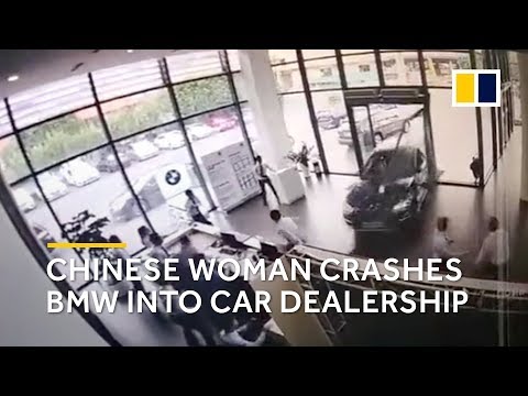 Chinese woman plunges BMW into car dealership while taking a test drive