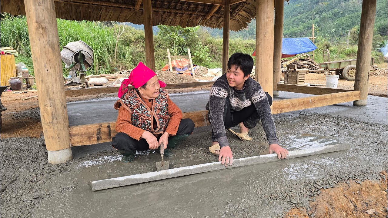 Thanh and the old woman worked together to renovate the house foundation and pour concrete for it.