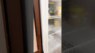 How do you open the refrigerator door?