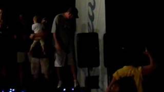 Drunk guy backflips off a stage and eats it.