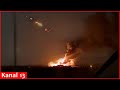 Russians watch the downed Russian plane burn in the air - The footage