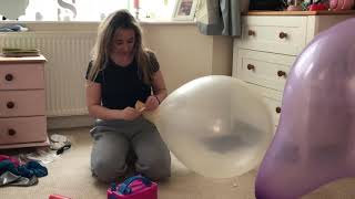 Blowing Up Two Enormous Purple And Clear Balloons
