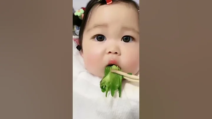 cute baby eating vegetables
