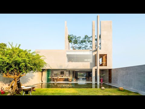 Видео: Първоначално проектирана семейна резиденция във Виетнам, показваща зелени фасади