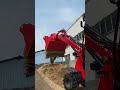 Rippa RB06 backhoe digging in the sand with small bucket.