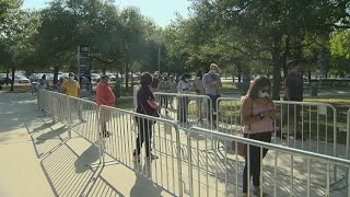 Thousands of Bexar County residents endure long lines to cast an early ballot on Day 1 of early voti