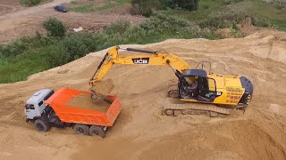 Погрузка самосвала Камаз 43118 экскаватором JCB JS240LC - drone video