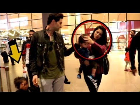 sunny-leone-and-husband-ignore-crying-adopted-daughter-at-the-airport