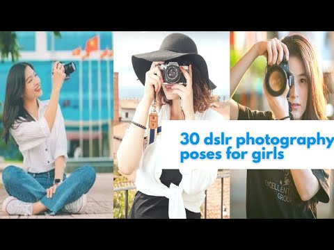 Man photographer with a DSLR camera in her hands posing - stock photo  3190148 | Crushpixel