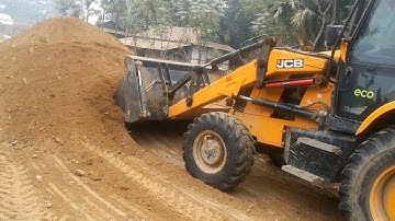 JCB Backhoe Machine Working For Village Road Construction - JCB Leveling Mud in Road