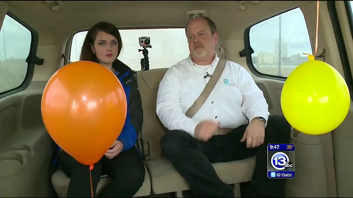 Floating helium balloon in a moving car