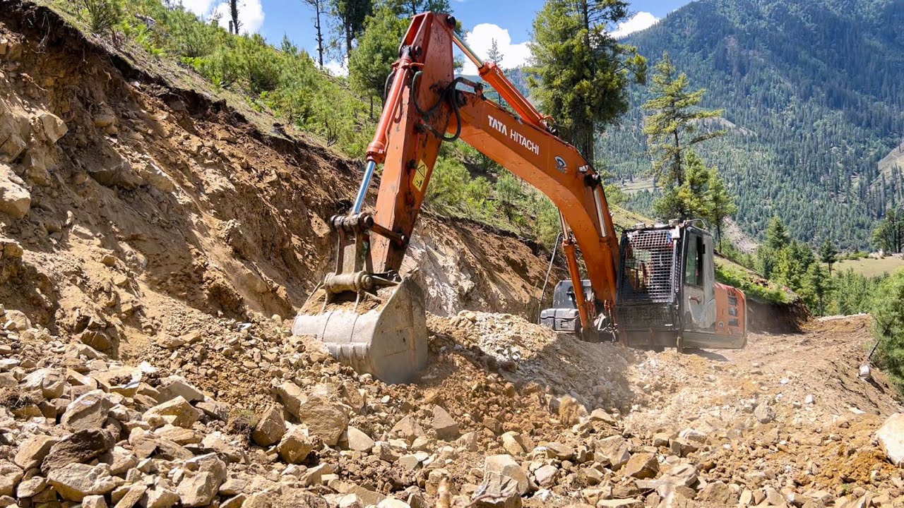 Expert Operator Cutting a Dangerous Steep Mountain for Narrow Hilly Road Construction. - 5