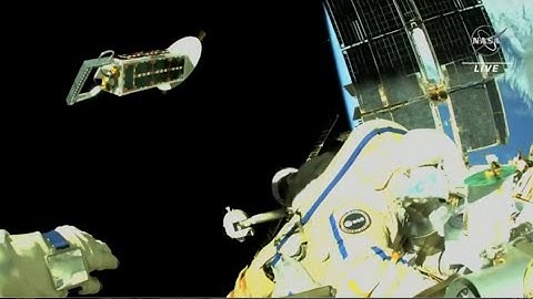 Spacewalker tosses cubesats away from space station in this amazing view