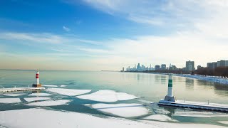 Aerial footage of the Chicago skyline & frozen Lake Michigan