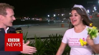 Moment bride-to-be crashes Olympic coverage - BBC News
