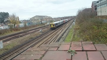 Fast Class 159 and 158 pass Wimbledon Train