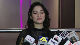 Tamanna Bhatia showing sexy LEGS in black dress at the screening of F2 Fun and Frustration