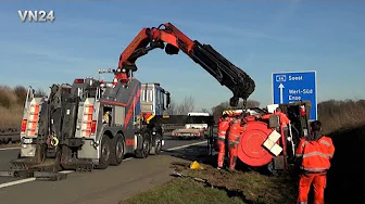 VN24 - Special suction tanker truck tips onto its side in the ditch on the A44