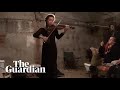 Violinist plays in bomb shelter for displaced Ukraine residents