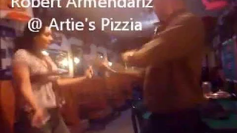 Robert Armendariz dancing at Artie's Pizzia