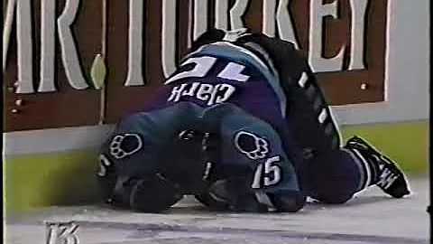 Darcy Simon hits Kerry Clark IHL 96/97