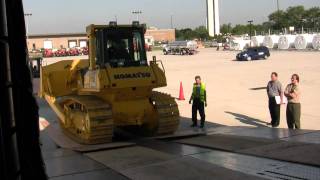 Loading the heavy earth moving equipment on the Antonov 124 at HIA