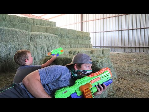 Using nerf guns on the farm | Stopping the bad guy from taking our hay | Nerf gun for kids